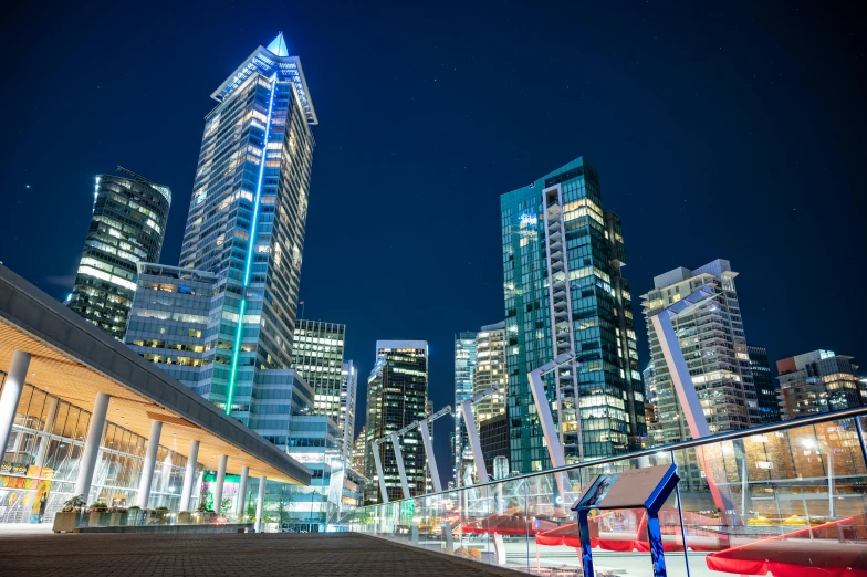 the city skyline is lit up at night, pexels contest winner, vancouver school, avatar image, streetscape, high resolution image, 1 2 9 7