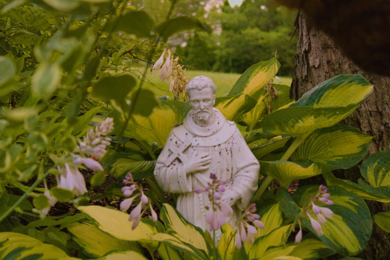 a statue of a man in a garden, by Carey Morris, unsplash, renaissance, still from the the sopranos, patron saint of 🛸🌈👩🏾, still frame from a movie, christian saint