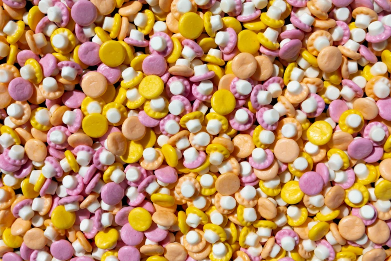 a pile of pink, yellow and white sprinkles, inspired by Peter Alexander Hay, plasticien, scattered gold coins, in pastel shades, made of dots, flora