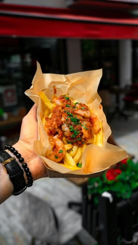 a close up of a person holding a plate of food, inspired by Pia Fries, pexels, hurufiyya, shrimp, square, jakarta, 2995599206