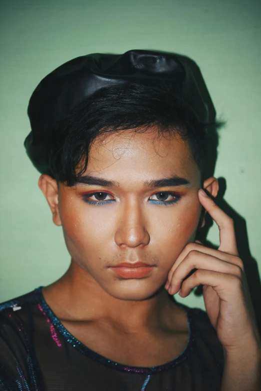 a woman holding a cell phone to her ear, an album cover, inspired by Oka Yasutomo, trending on pexels, sumatraism, nonbinary model, handsome eyes, low quality photo, prideful look