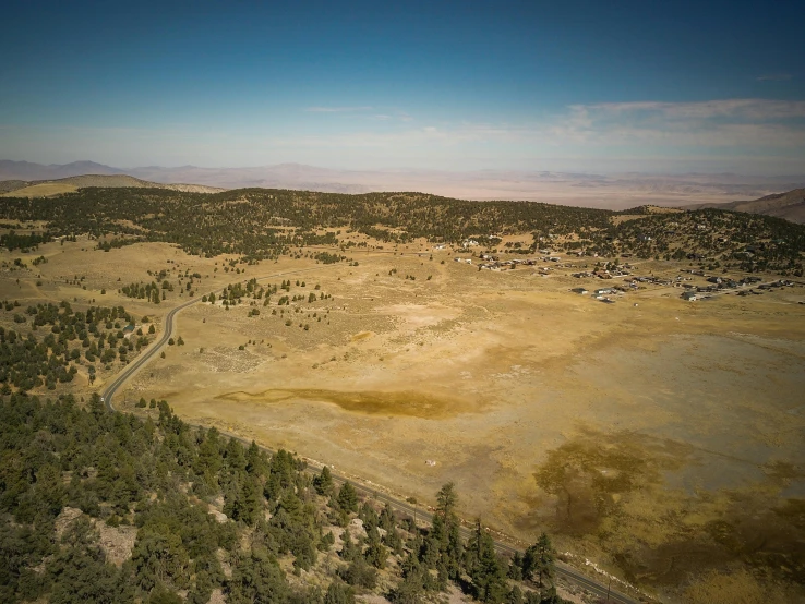 an aerial view of a large open field, by Arnie Swekel, unsplash, les nabis, square, black mesa, background image, wood cabin in distance