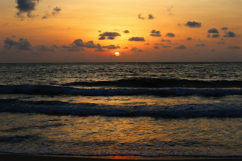 the sun is setting over the ocean on the beach, by Carey Morris, pexels contest winner, sri lanka, profile image, varadero beach, hd footage