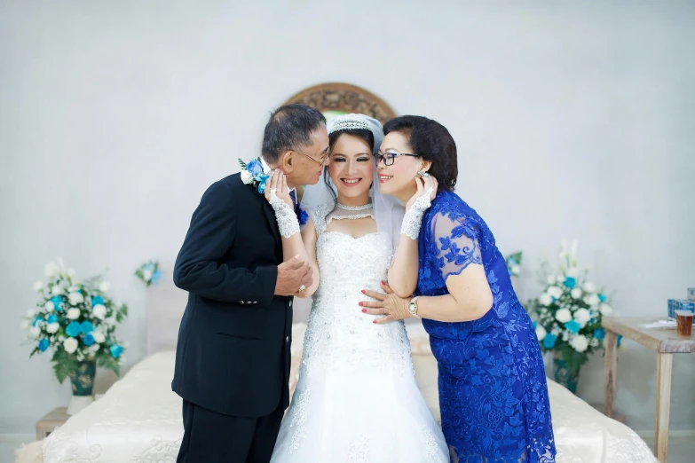 a couple of people standing next to each other, by Basuki Abdullah, kissing, momma and papa, formal wear, professional photo-n 3