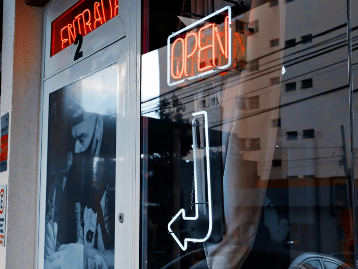 a store front with a neon sign in the window, unsplash, jukebox, open vault, thumbnail, p. j. n