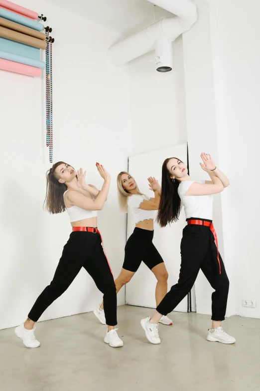 a group of young women dancing in a dance studio, an album cover, by Emma Andijewska, trending on pexels, pants, white backdrop, 15081959 21121991 01012000 4k, tiktok
