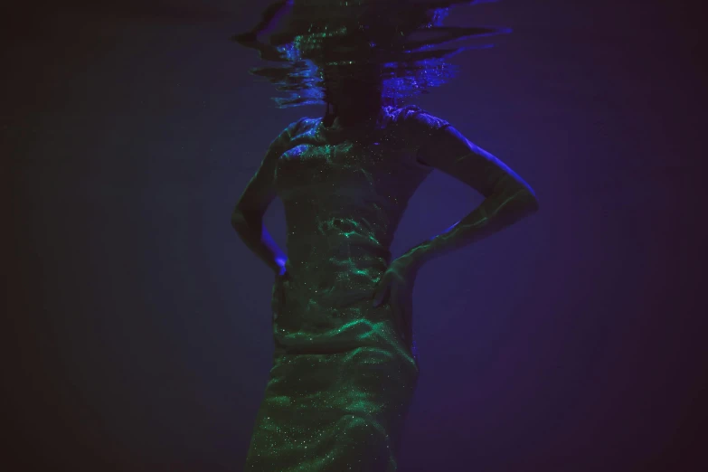 a woman that is standing in the water, inspired by Elsa Bleda, unsplash, holography, phosphorescent, translucent dress, deep colour, mermaid