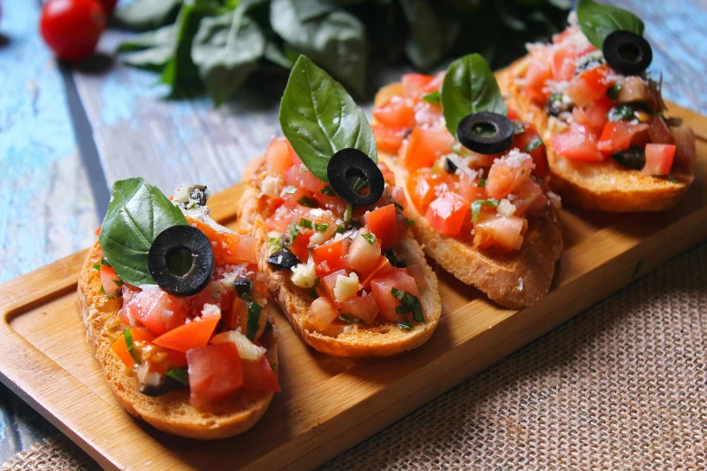 three pieces of bread topped with tomatoes and olives, by Julia Pishtar, basil leaves instead of leaves, listing image, fan favorite, buzzed sides