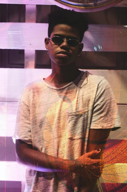 a man that is standing in front of a clock, an album cover, by Max Dauthendey, unsplash, hurufiyya, wearing shades, boyish face, around 1 9 years old, ((portrait))