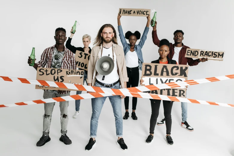 a group of people holding up protest signs, by Matija Jama, pexels contest winner, black arts movement, full body portrait of a group, cardboard cutout, avatar image, black and brown