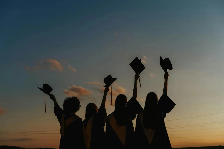 a group of graduates holding their caps in the air, by Carey Morris, pexels, evening sunlight, background image, profile image, black