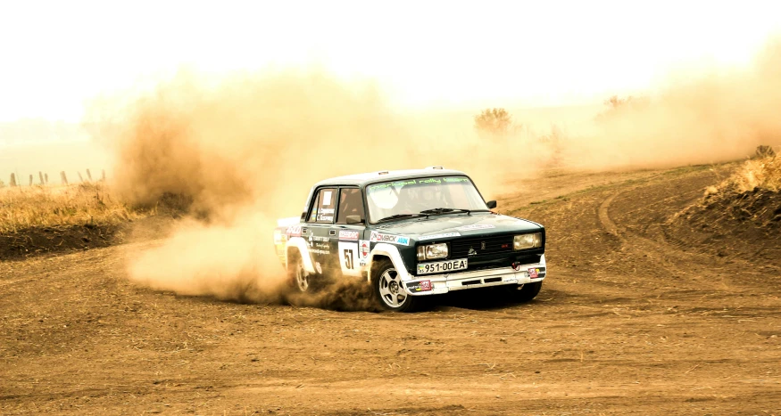 a truck that is driving down a dirt road, lada, smoke behind wheels, at racer track, profile image