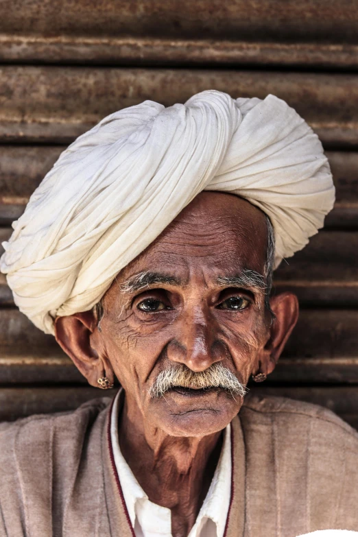 an old man with a turban on his head, a character portrait, inspired by Steve McCurry, pexels contest winner, square masculine facial features, buzzed hair on temple, farmer, thin moustache