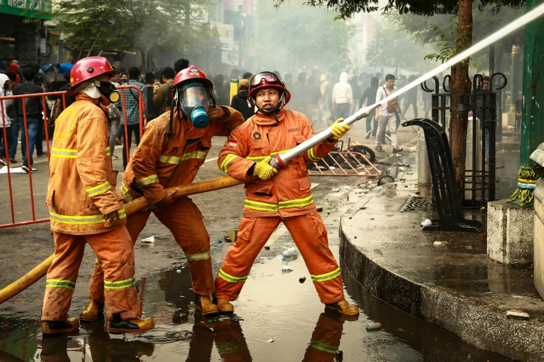 a group of firefighters standing next to each other on a street, by Fei Danxu, gutai group, people fighting, first place, avatar image