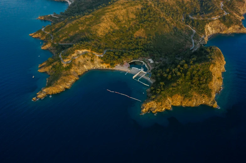 an aerial view of a small island in the middle of the ocean, by Daren Bader, pexels contest winner, hurufiyya, picton blue, summer evening, turkey, port