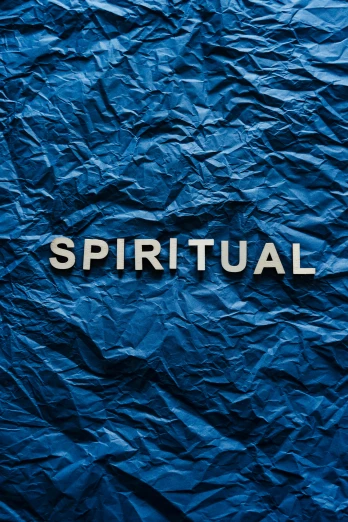 a blue crumpled paper with the word spiritual written on it, an album cover, by Paul Bird, unsplash, icon, market, m