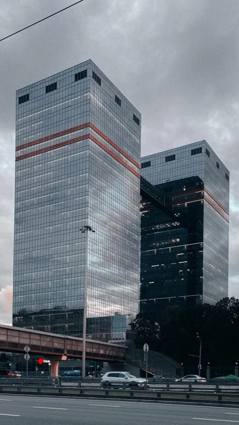 a couple of tall buildings sitting next to each other, by Xavier Blum Pinto, pexels contest winner, hyperrealism, glass and metal : : peugot onyx, brazil, cinematic establishing shot, instagram story