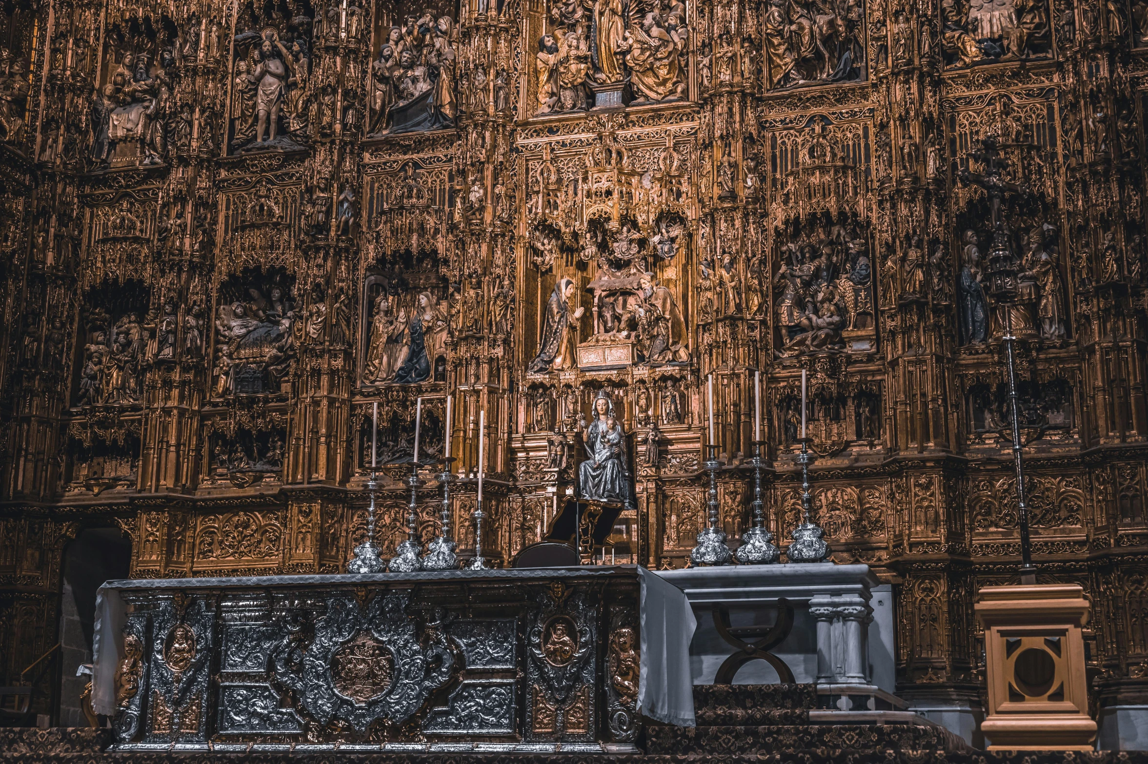 a close up of a wooden altar in a church, by Santiago Martínez Delgado, pexels contest winner, baroque, sitting on golden throne, gothic building style, thumbnail, ad image