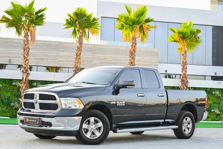 a black ram truck parked in front of a building, pexels contest winner, dau-al-set, twins, grey, gulf, pristine and clean