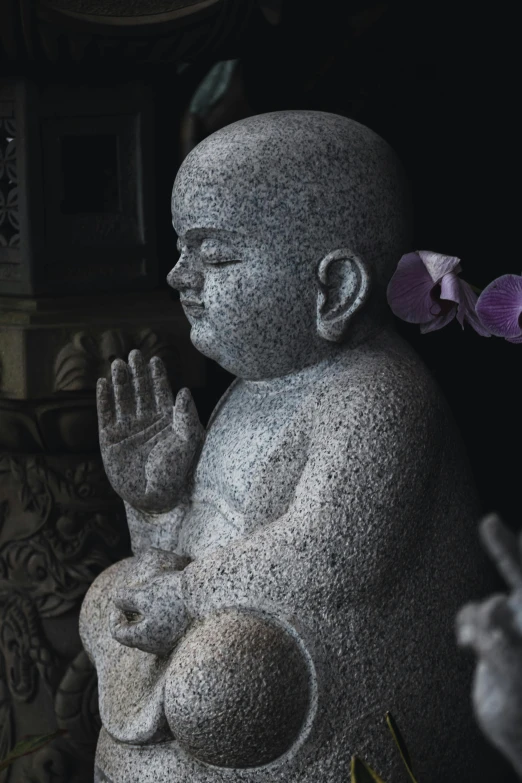 a statue of a baby with a flower in its hair, a statue, by Sam Dillemans, unsplash, buddhist monk meditating, grey, low detail, high quality image