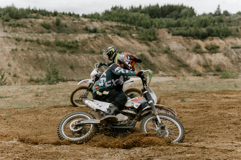 a man riding on the back of a dirt bike, unsplash, figuration libre, a pair of ribbed, motorbikers race in hell, profile image, gray