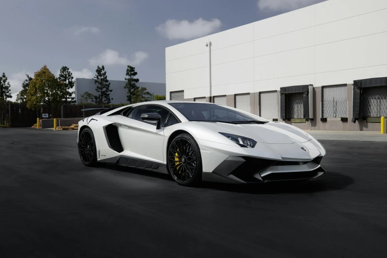 a white sports car parked in front of a building, lamborghini aventador photoshoot, ultra high res, $100000000, **cinematic