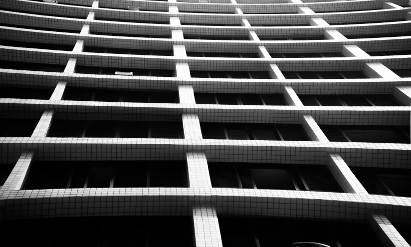 a black and white photo of a building, inspired by Ned M. Seidler, unsplash, tokyo kowloon, detiled, modern high sharpness photo