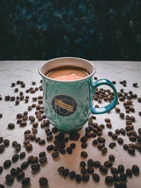 a cup of coffee surrounded by coffee beans, a colorized photo, inspired by Elsa Bleda, pexels contest winner, teal color graded, hot cocoa drink, thumbnail, premium