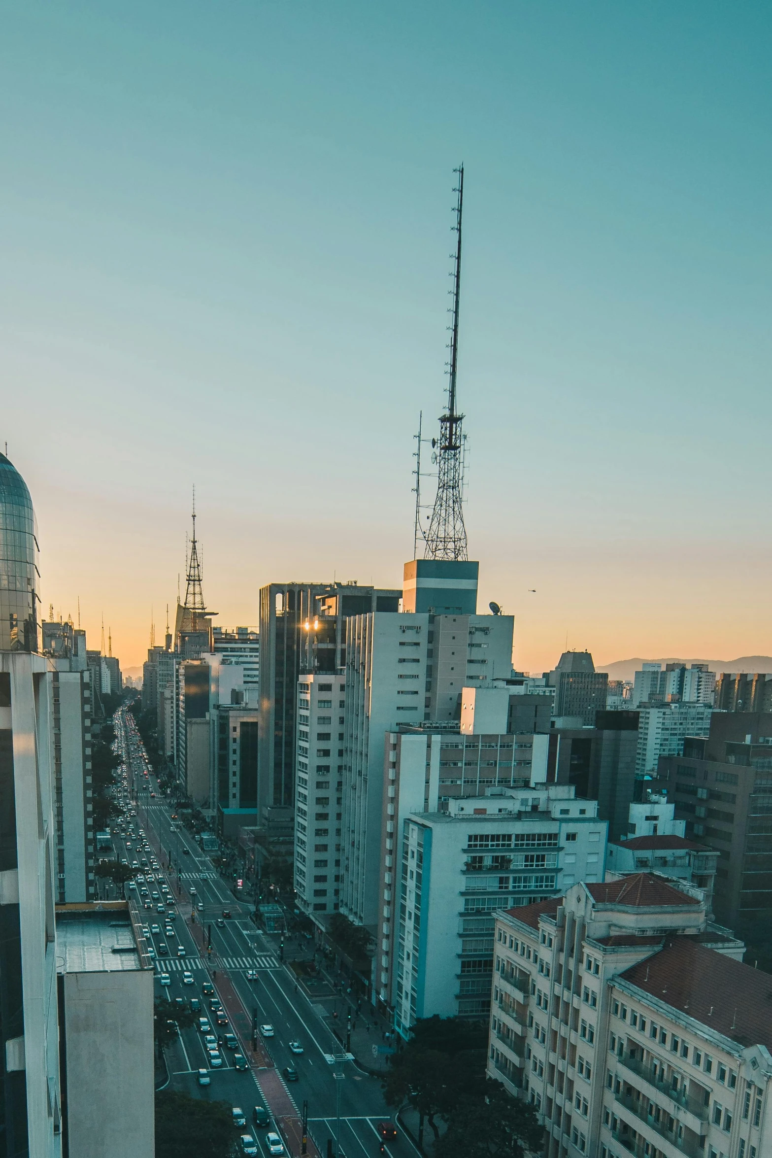 a view of a city from the top of a building, by Felipe Seade, taken at golden hour, high-quality photo