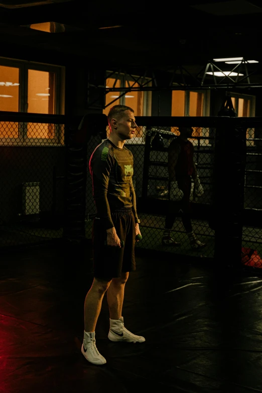 a man standing in the middle of a boxing ring, a hologram, by Adam Marczyński, conor mcgregor, full body image, in a gym, fencing