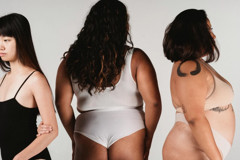 a group of women standing next to each other, by Matija Jama, trending on pexels, renaissance, curvy accentuated booty, ivory skin, three women, white background
