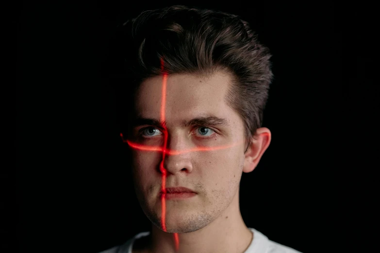 a man with a red cross on his face, a hologram, by Adam Marczyński, pexels contest winner, golden ratio face, peter parker, half - length head portrait, without lightsaber