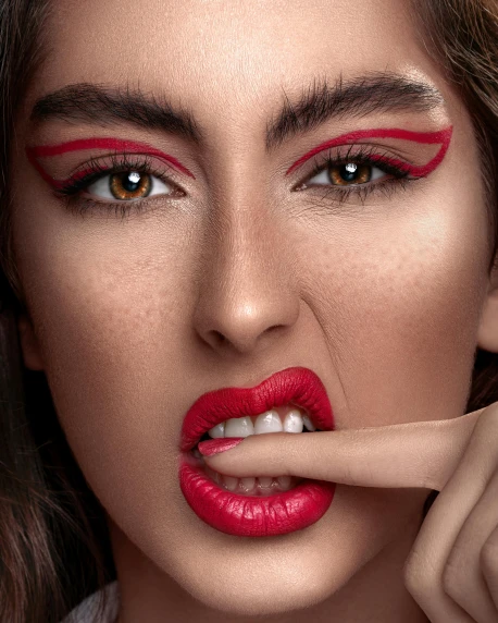 a close up of a woman with a finger on her lips, a colorized photo, inspired by Hedi Xandt, trending on pexels, thin red lines, dua lipa, dramatic”, dramatic ”