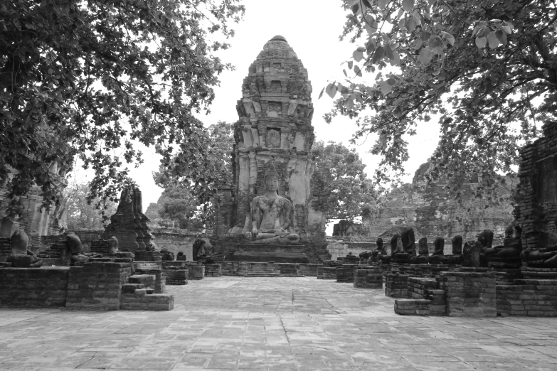 a black and white photo of a temple, a black and white photo, nuttavut baiphowongse, statues, ground level view, ancient city