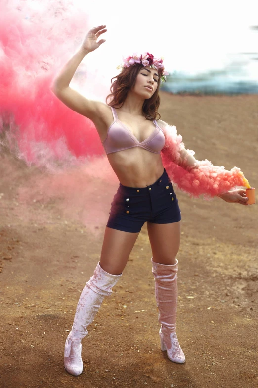 a woman standing on top of a dirt field, a colorized photo, inspired by David LaChapelle, trending on pexels, made of cotton candy, bra and shorts streetwear, aubrey plaza, glamourous cosplay