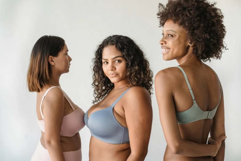 three women in underwear standing next to each other, a colorized photo, by Carey Morris, unsplash, posing together in bra, soft curvy shape, various colors, eucalyptus