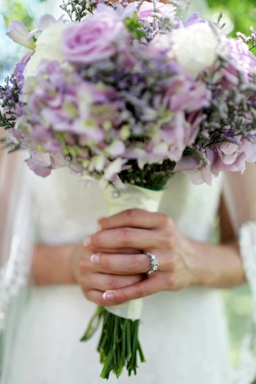 a bride holding a bouquet of purple and white flowers, dan mumfor, hazy, award - winning details ”, reaching