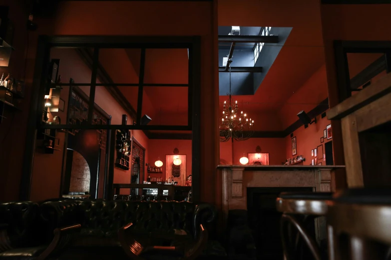 a room filled with lots of tables and chairs, inspired by Richmond Barthé, unsplash, art nouveau, cinematic and dramatic red light, in a dark dusty parlor, night time render, cinematic view from lower angle
