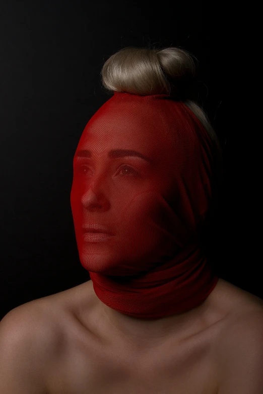 a woman with a red head covering her face, an album cover, inspired by Odd Nerdrum, hyperrealism, red body suit, portrait of kim petras, 3d realistic, silicone skin