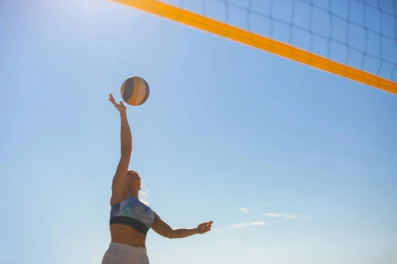 a woman reaching up to hit a volleyball ball, unsplash contest winner, arabesque, clear blue skies, sunburn, tv still, profile image