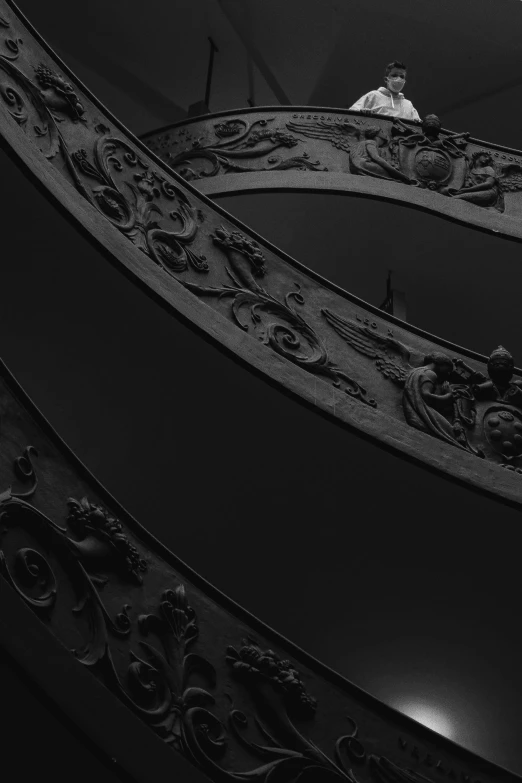 a black and white photo of a spiral staircase, an album cover, unsplash contest winner, baroque, made of bronze, dark. no text, vatican, brutal shapes high detail 8k