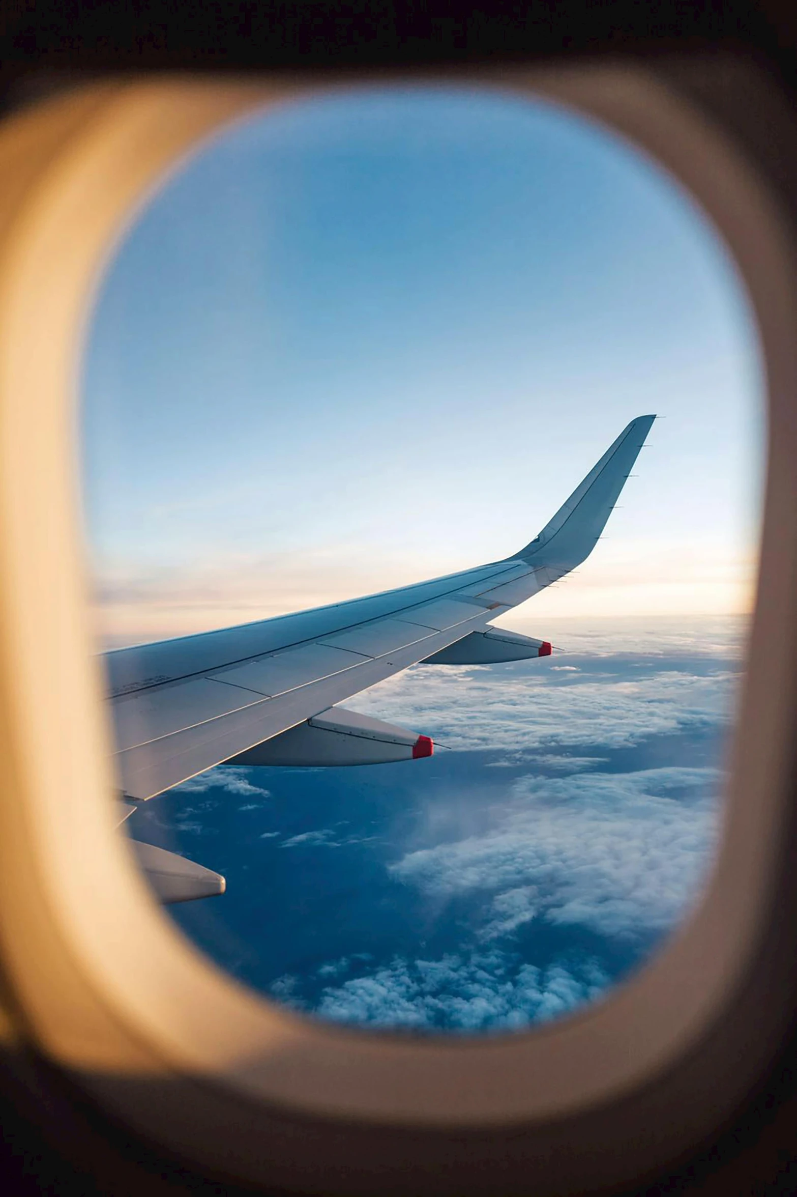 a view of the wing of an airplane through a window, pexels contest winner, gazing off into the horizon, looping, rounded corners, plain stretching into distance