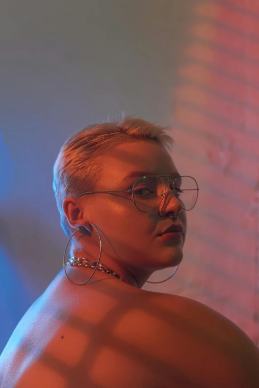 a woman with glasses standing in front of a brick wall, an album cover, inspired by Elsa Bleda, trending on pexels, holography, florence pugh, girl with short white hair, nightlife, lesbians