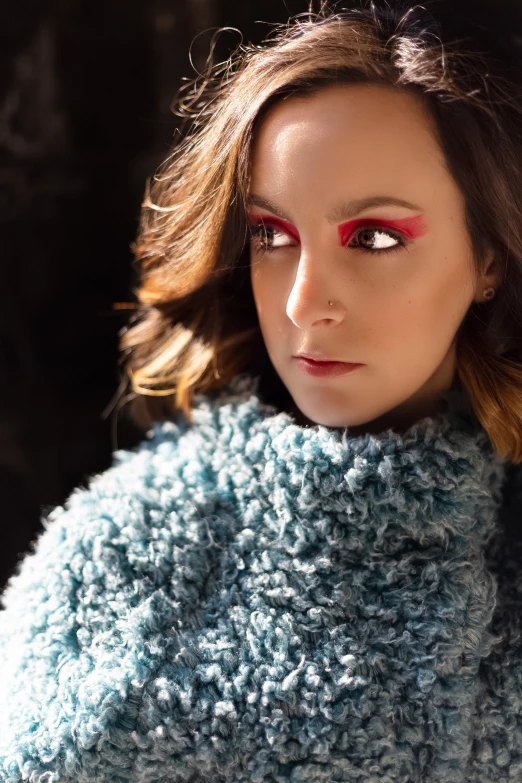 a close up of a person wearing a sweater, a portrait, inspired by Lucia Peka, trending on pexels, teal silver red, ana de la reguera portrait, square, glamour photography