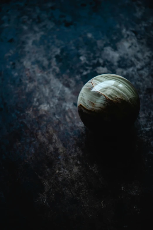 a close up of an onion on a table, unsplash, art photography, found in a cave made of clay, glossy sphere, 15081959 21121991 01012000 4k, made of wood