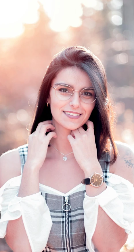 a woman in a plaid dress posing for a picture, a picture, by Julia Pishtar, transparent glasses, portrait image, portrait of sherlyn chopra, low quality photo