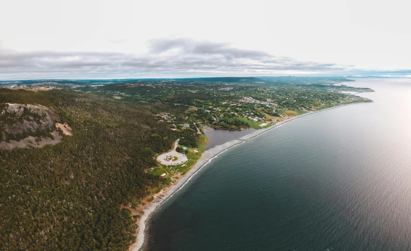 an aerial view of a large body of water, by Daniel Lieske, pexels contest winner, les nabis, quebec, coast as the background, craigville, college