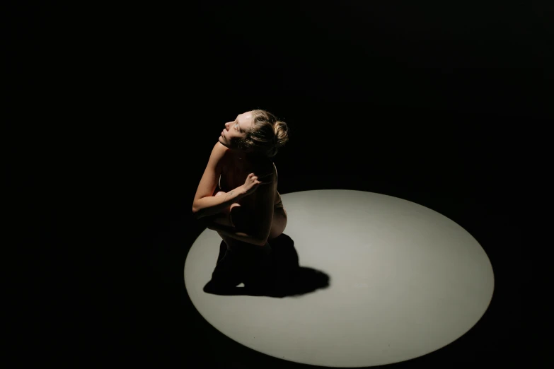 a woman sitting on top of a white circle, an album cover, unsplash, crawling out of a dark room, dramatic soft shadow lighting, ignant, beth cavener