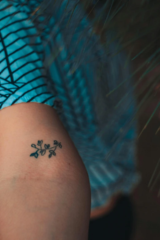 a woman with a small tattoo on her arm, a tattoo, trending on unsplash, teal, square, blue flowers, lynn skordal