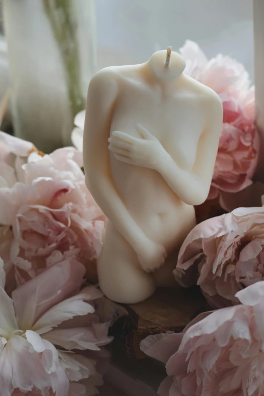 a close up of a candle with flowers in the background, a marble sculpture, inspired by Antonio Canova, romanticism, bare torso, singularity sculpted �ー etsy, covered with pink marzipan, female bodies